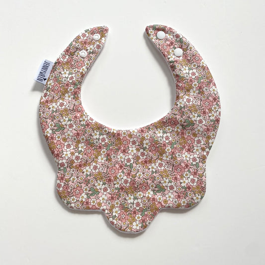 Pastel pink and yellow floral scallop bib