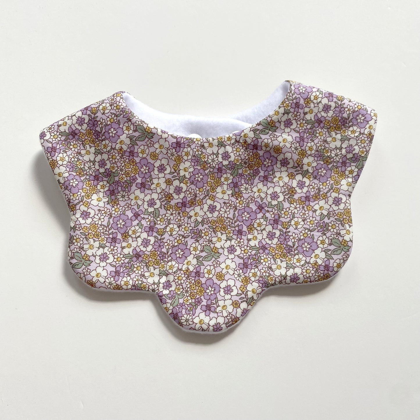 Pastel lilac and yellow floral scallop bib
