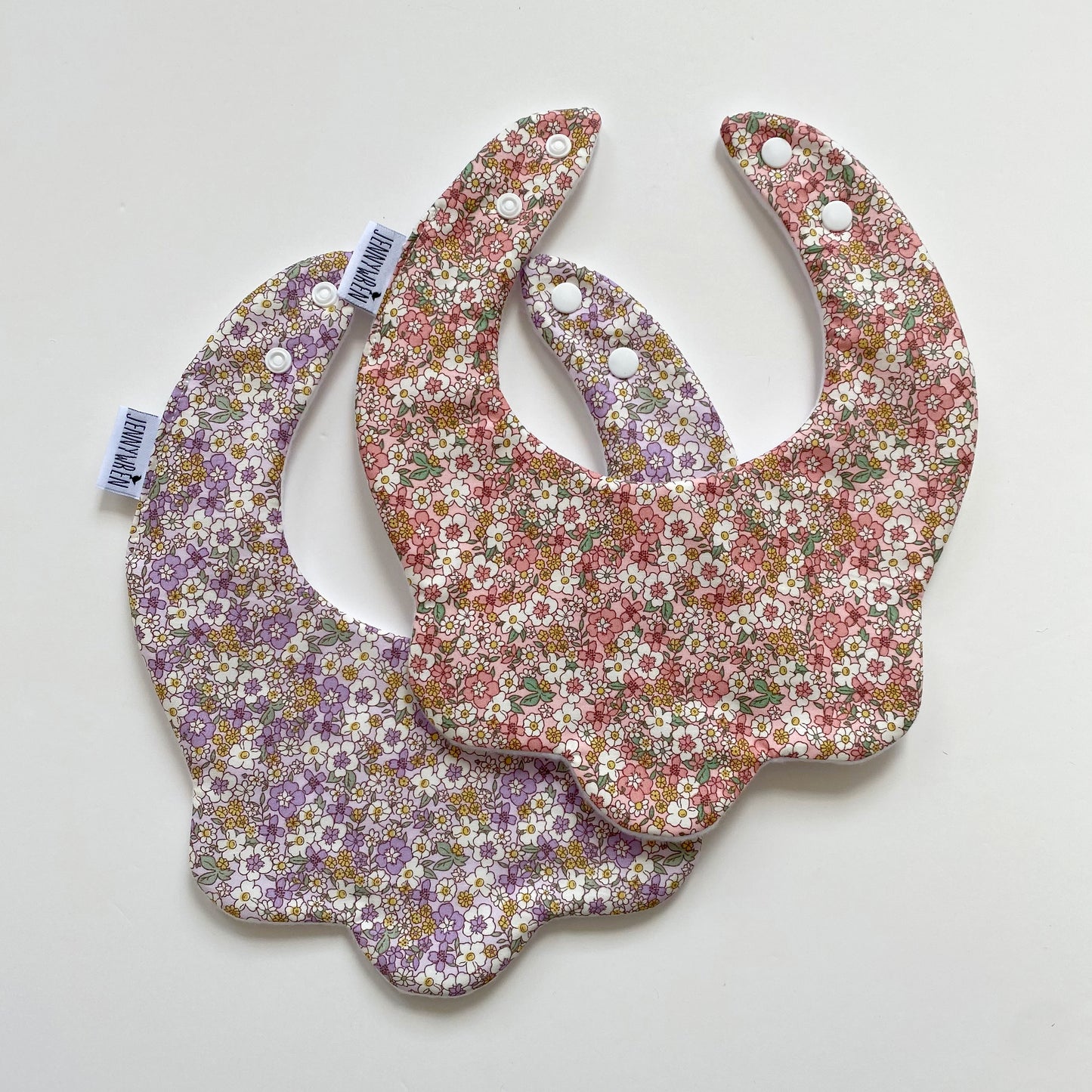 Choice of ditsy pink and lilac scallop bibs