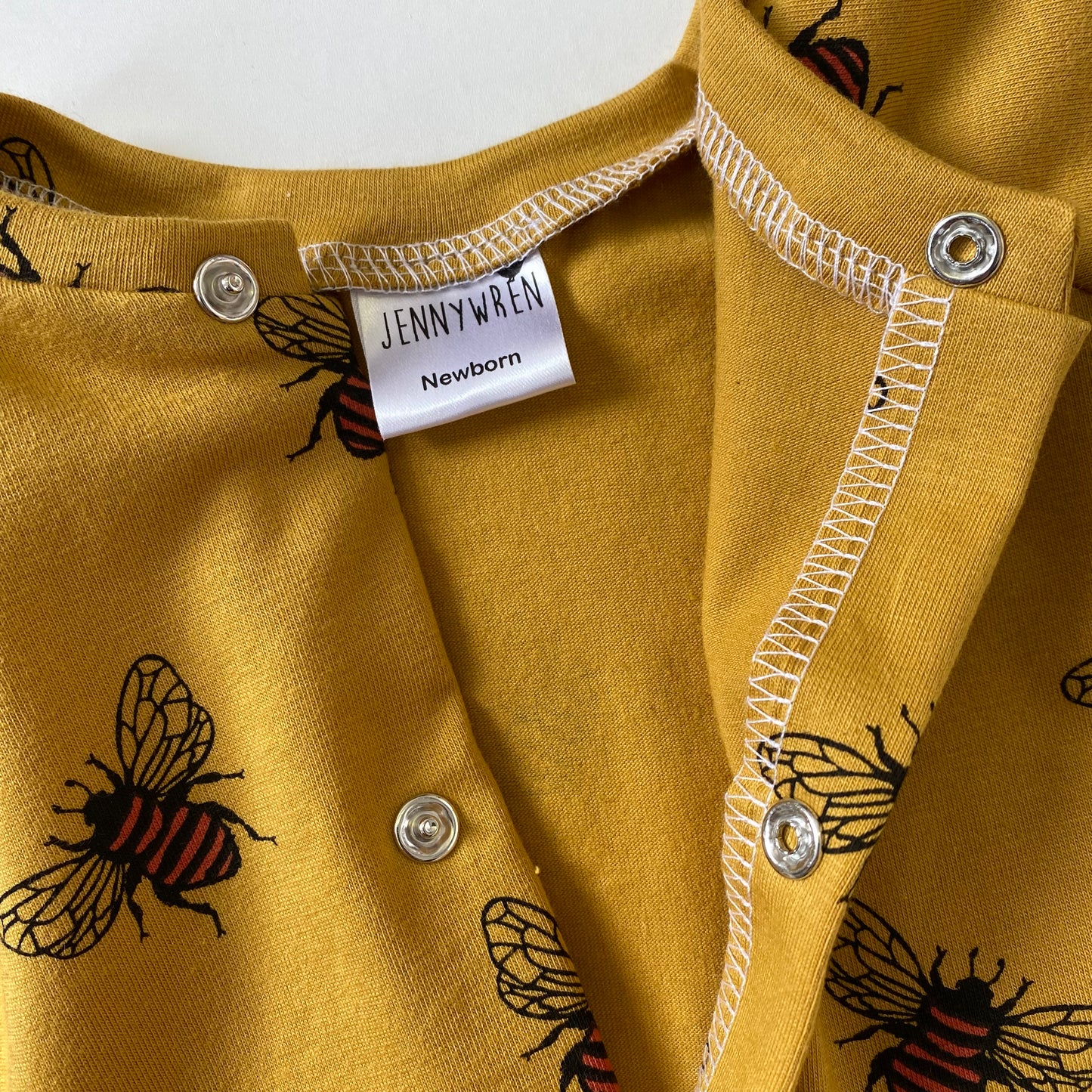Mustard bee footed babygrow