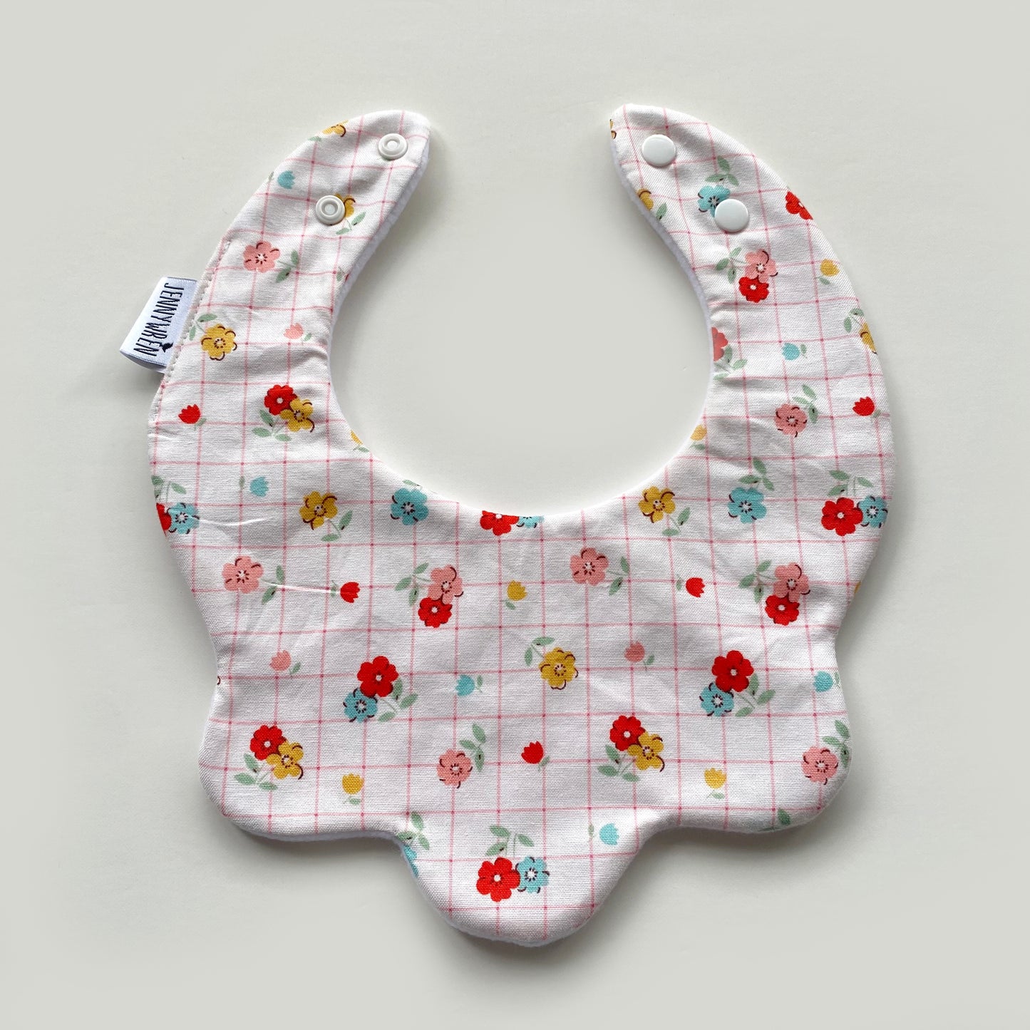 Floral with pink grid scallop bib
