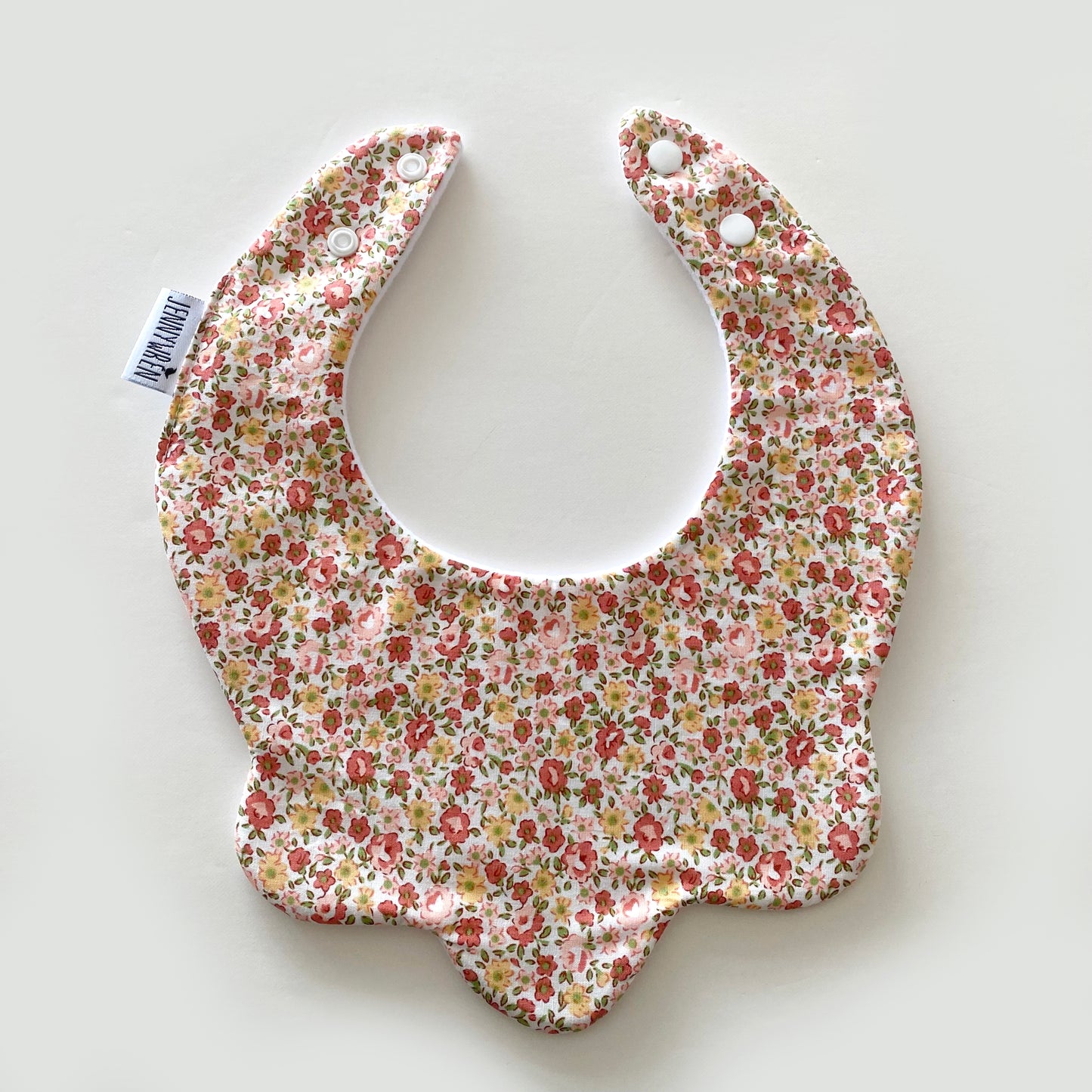 Rust and mustard ditsy floral scallop bib