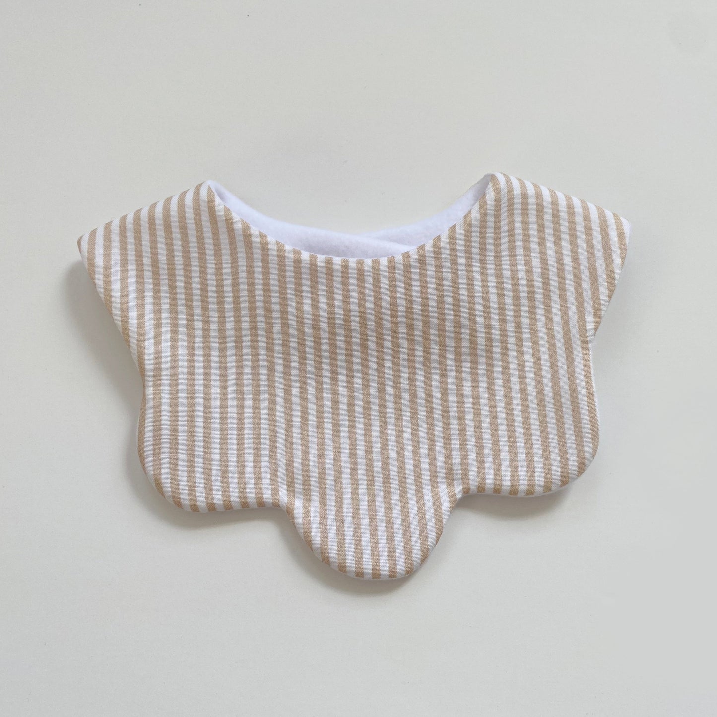 Beige stripe scallop bib