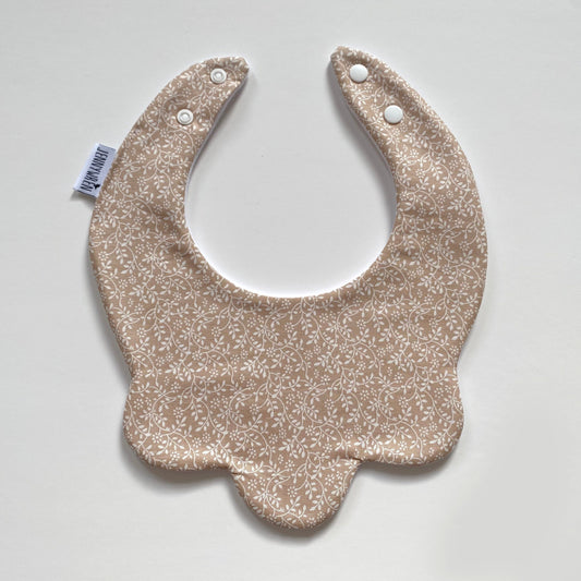 Nude ditsy scallop bib