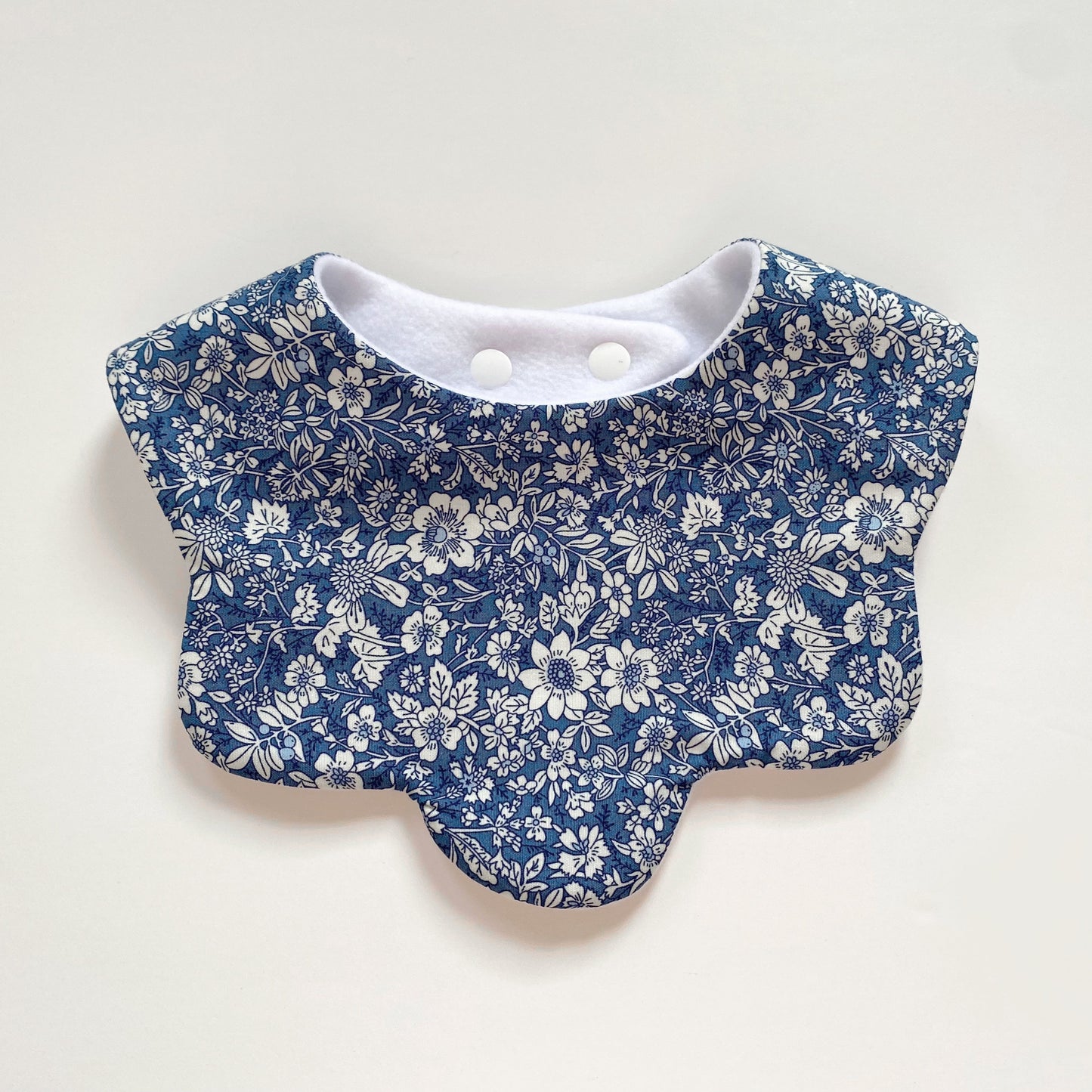 Blue ditsy floral scallop bib