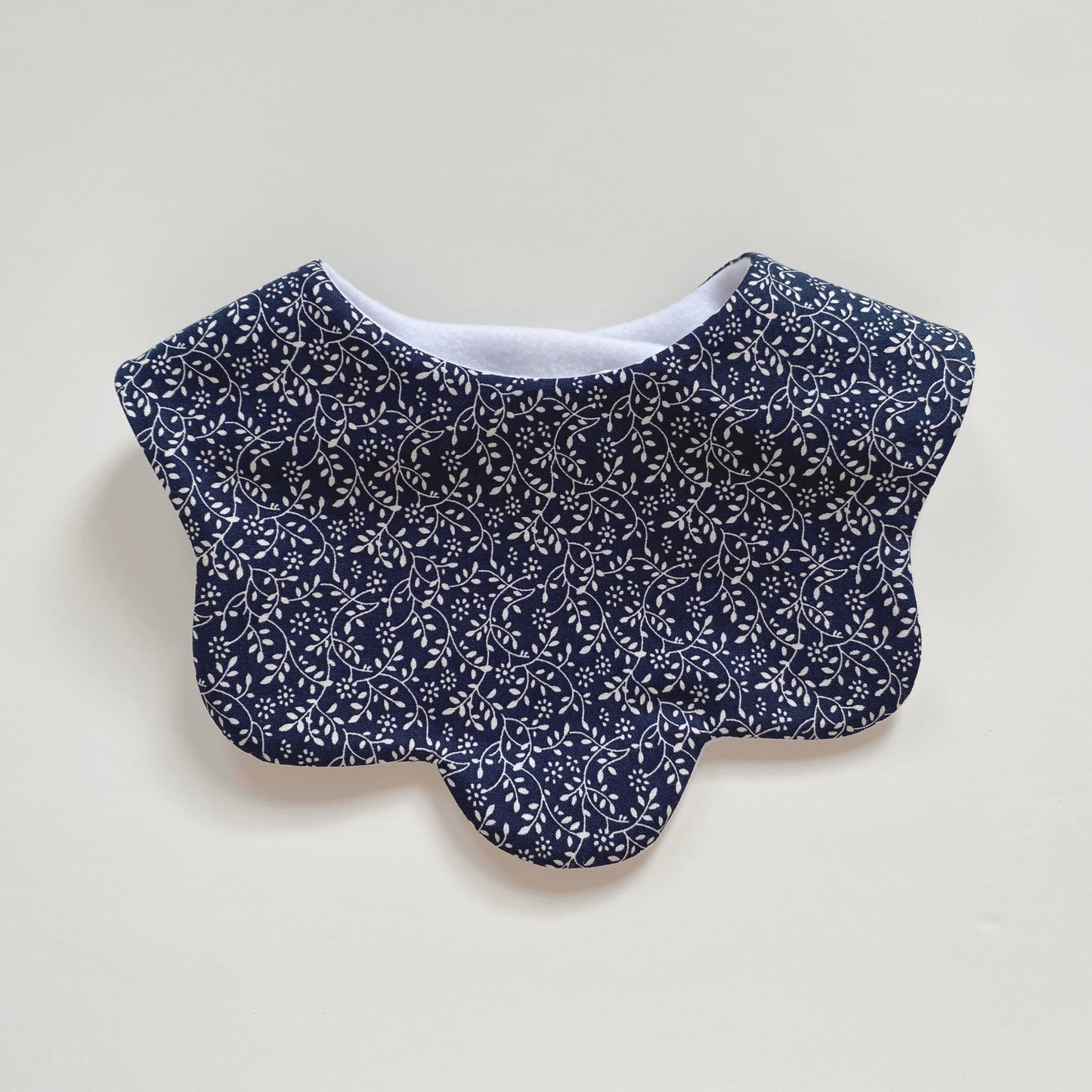 Midnight ditsy floral scallop bib