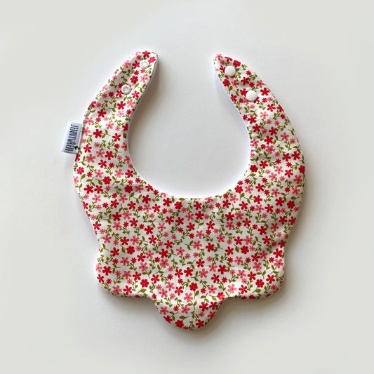 Red coral ditsy on cream scallop bib