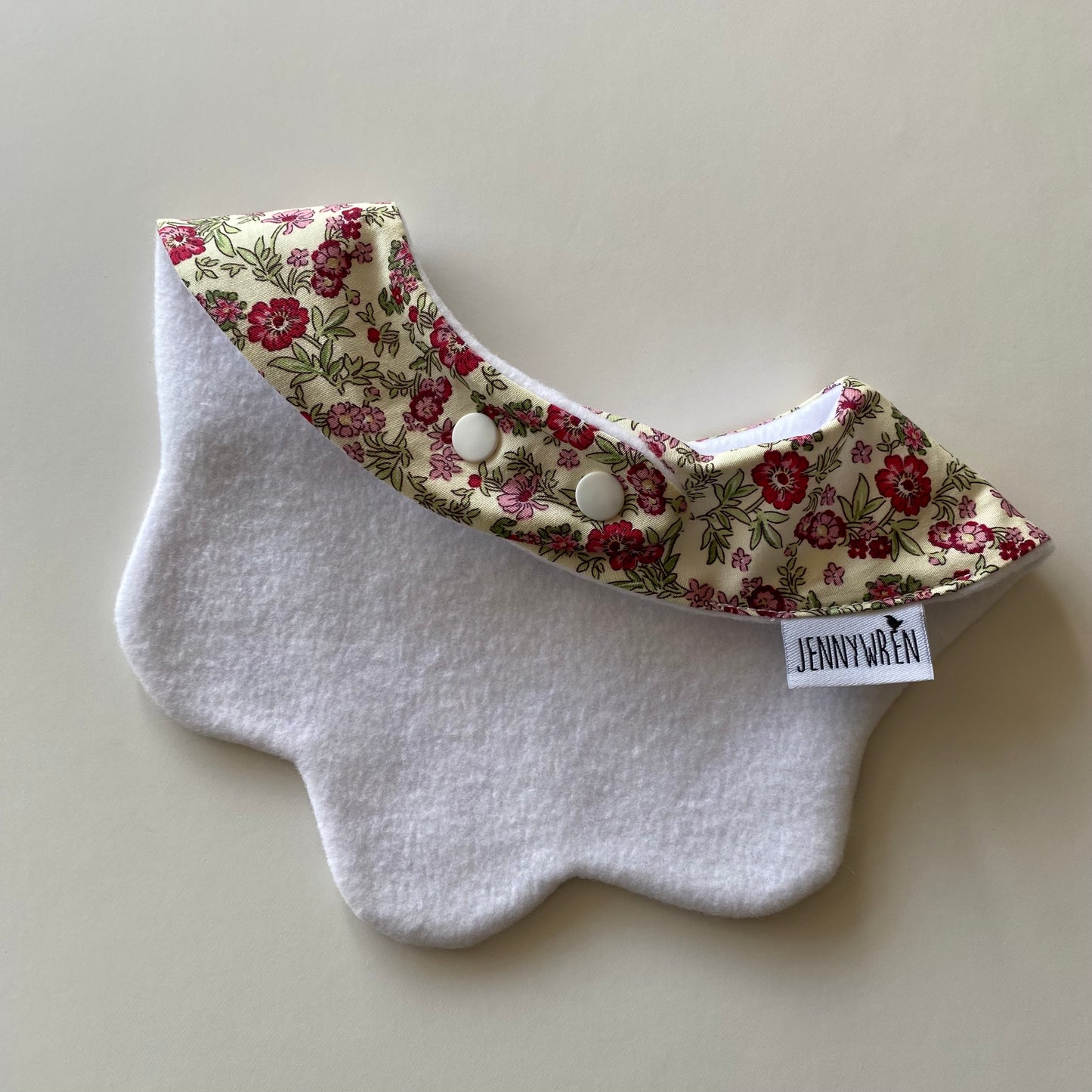 Cream red pink floral scallop bib