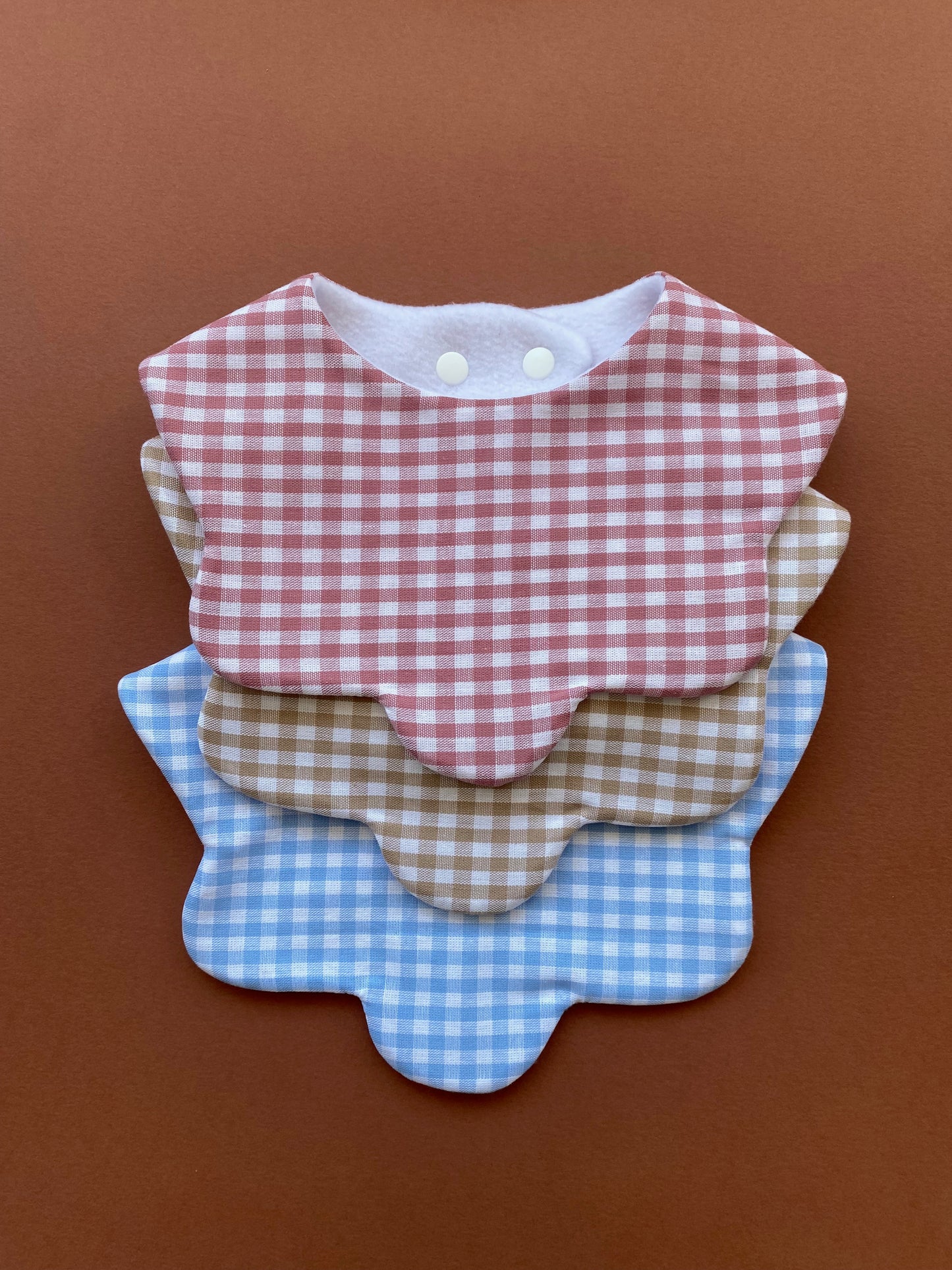 Choice of gingham scallop bib