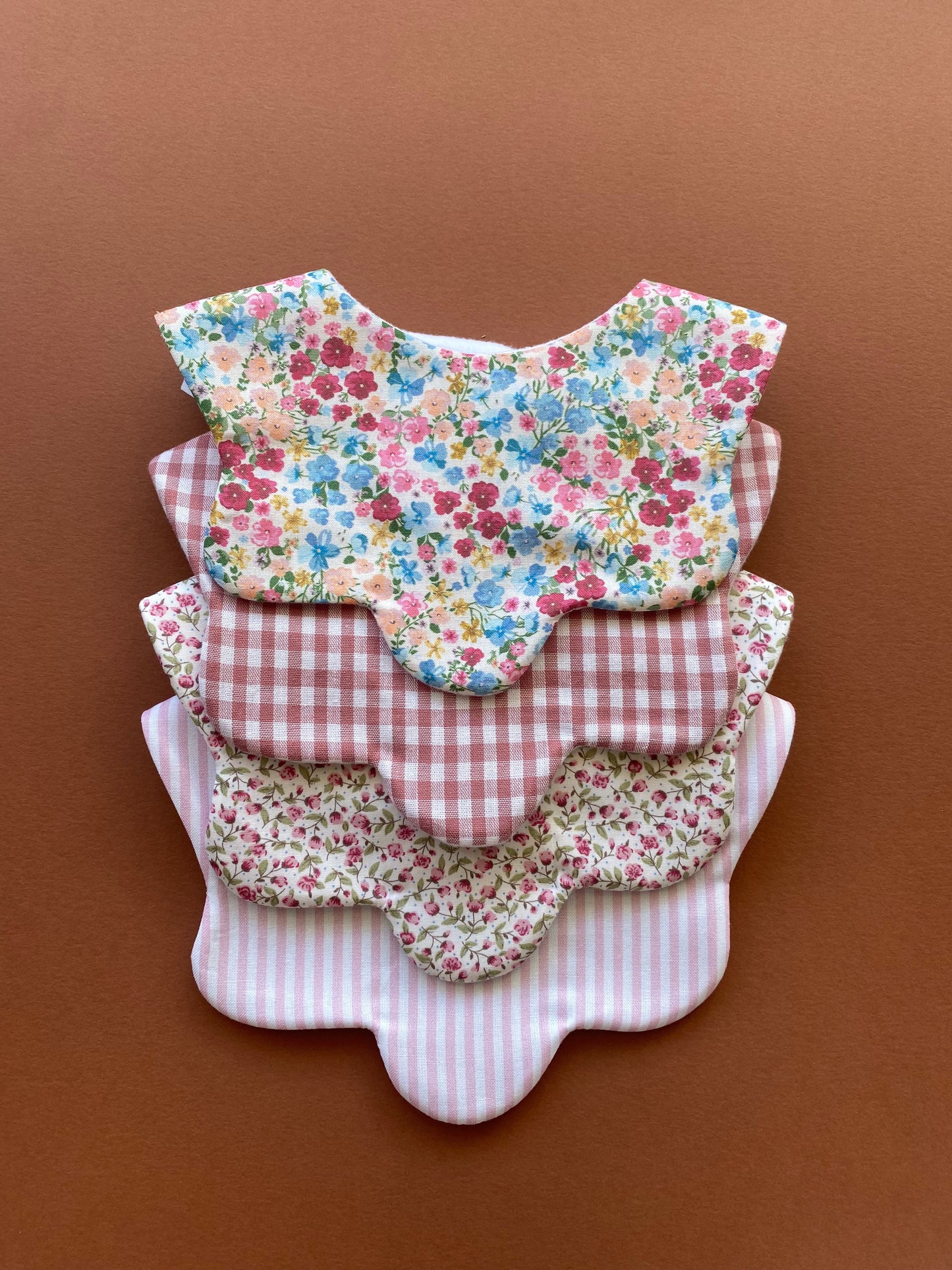 Choice of floral scallop bibs