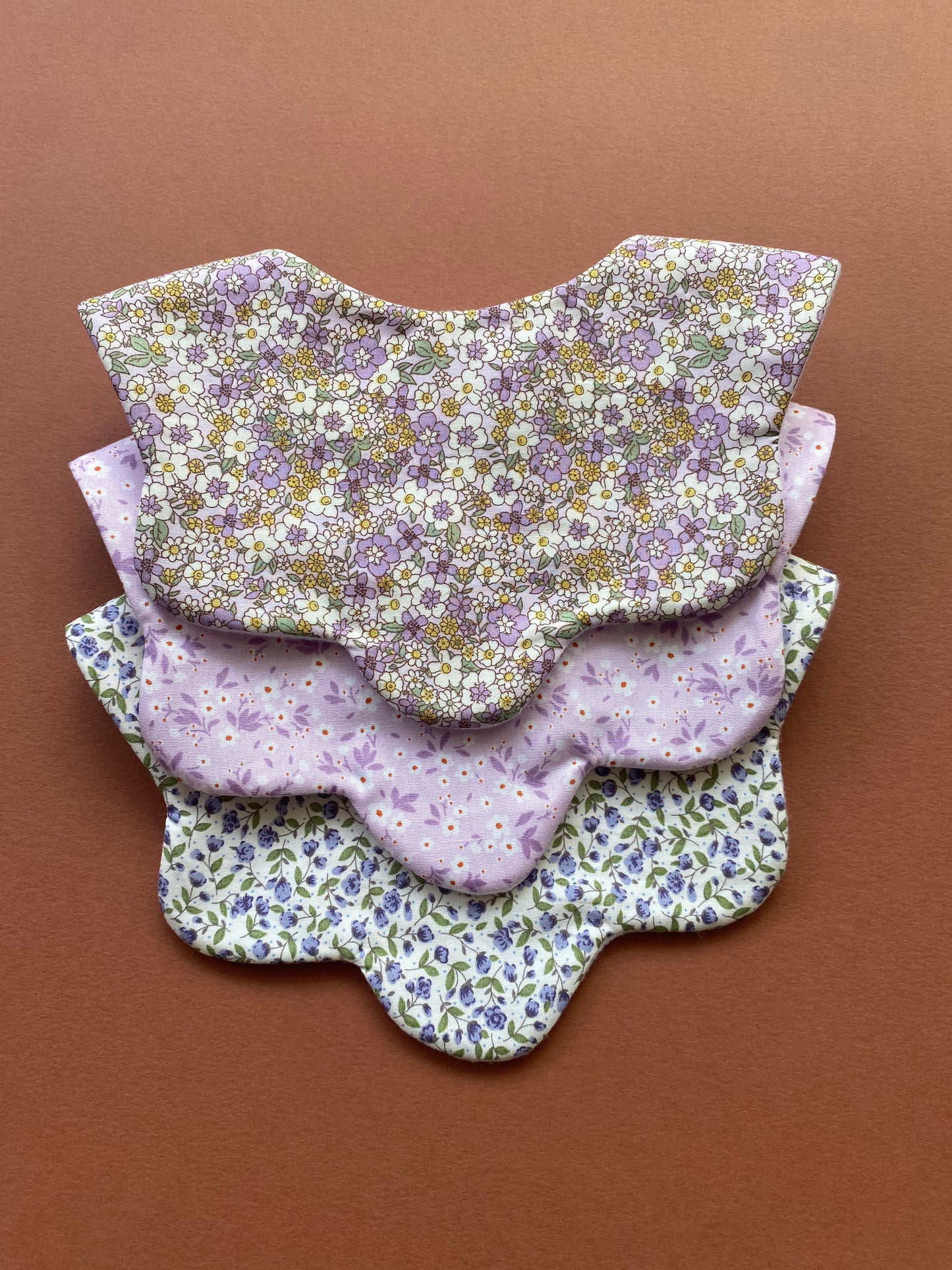 Choice of floral scallop bibs
