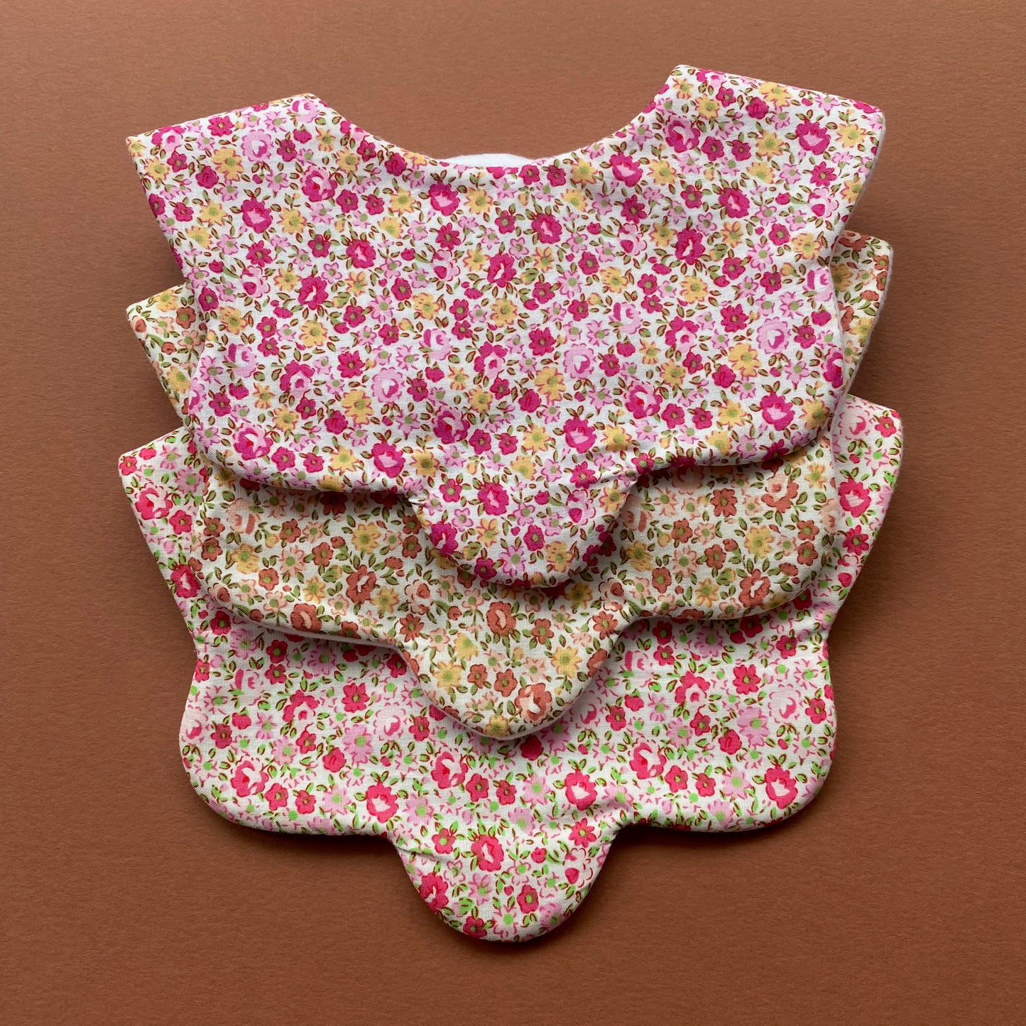 Choice of floral scallop bibs