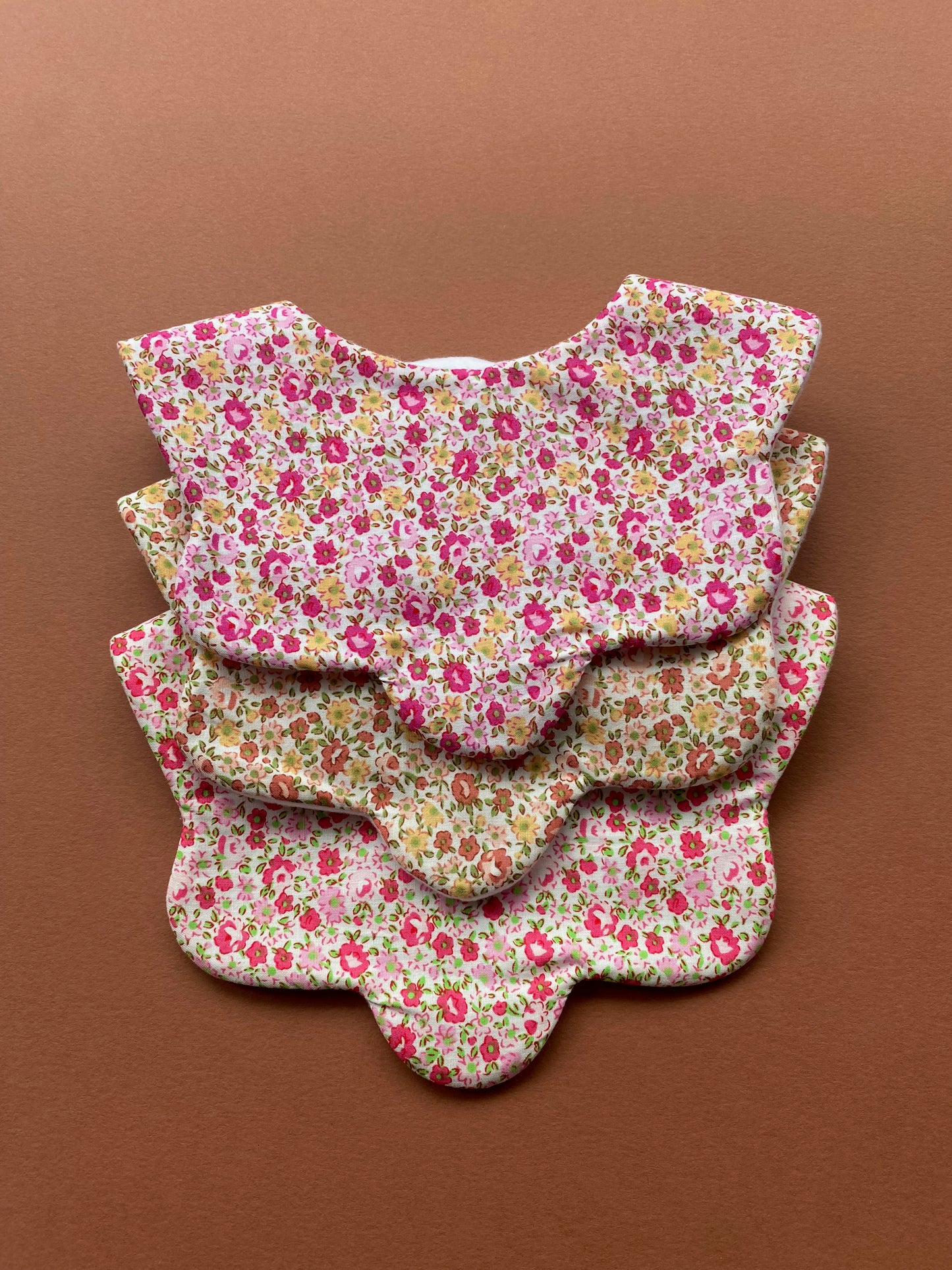 Choice of floral scallop bibs