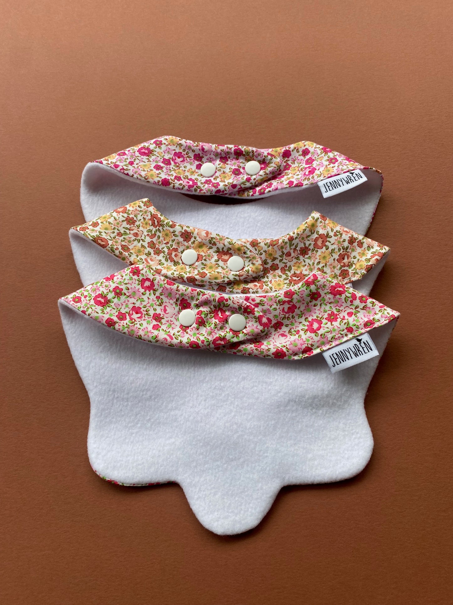 Choice of floral scallop bibs