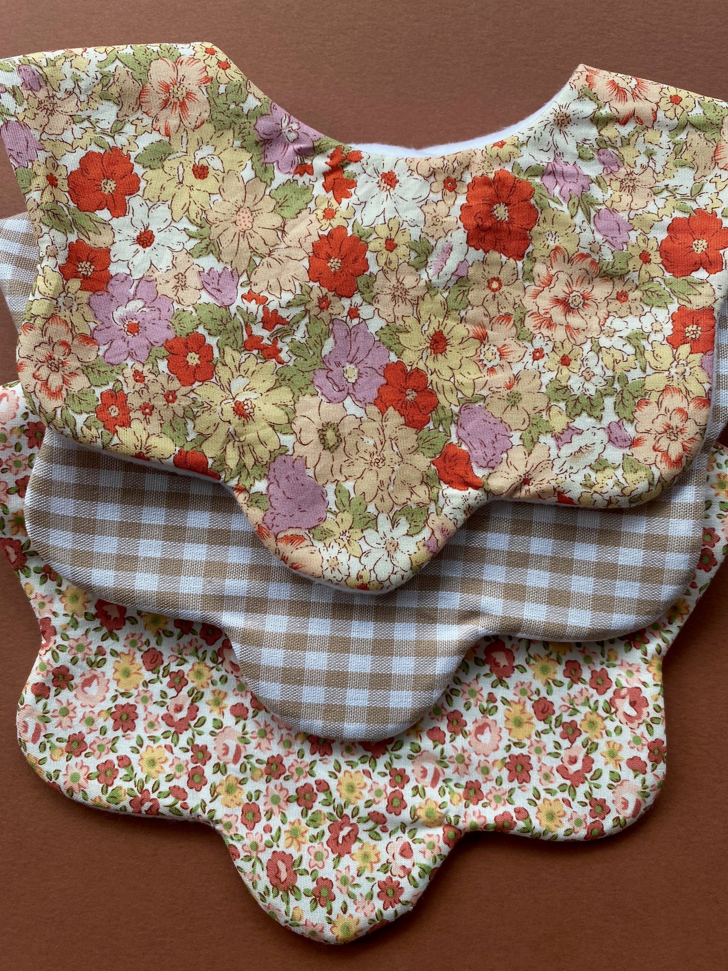 Choice of floral scallop bibs