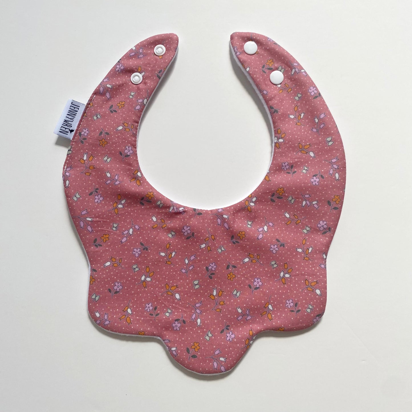 Pink ditsy scallop bib
