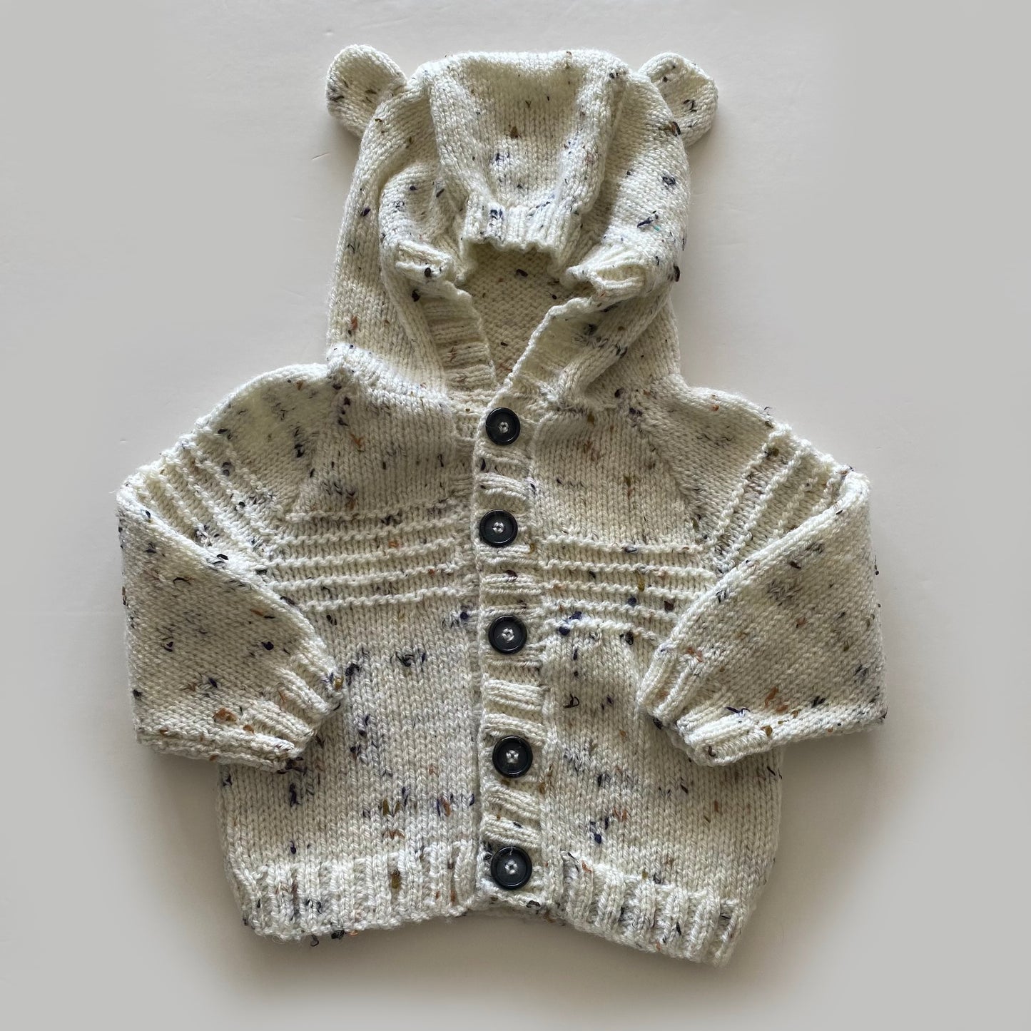 6-12M mottled cream hand-knitted cardigan with bear hood