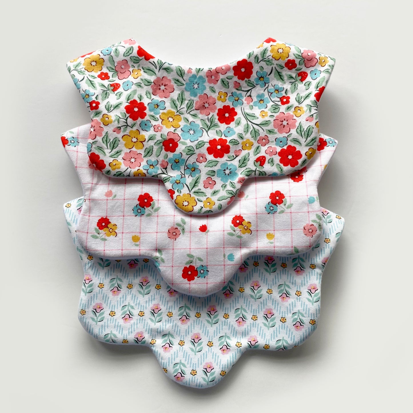 Choice of floral scallop bib