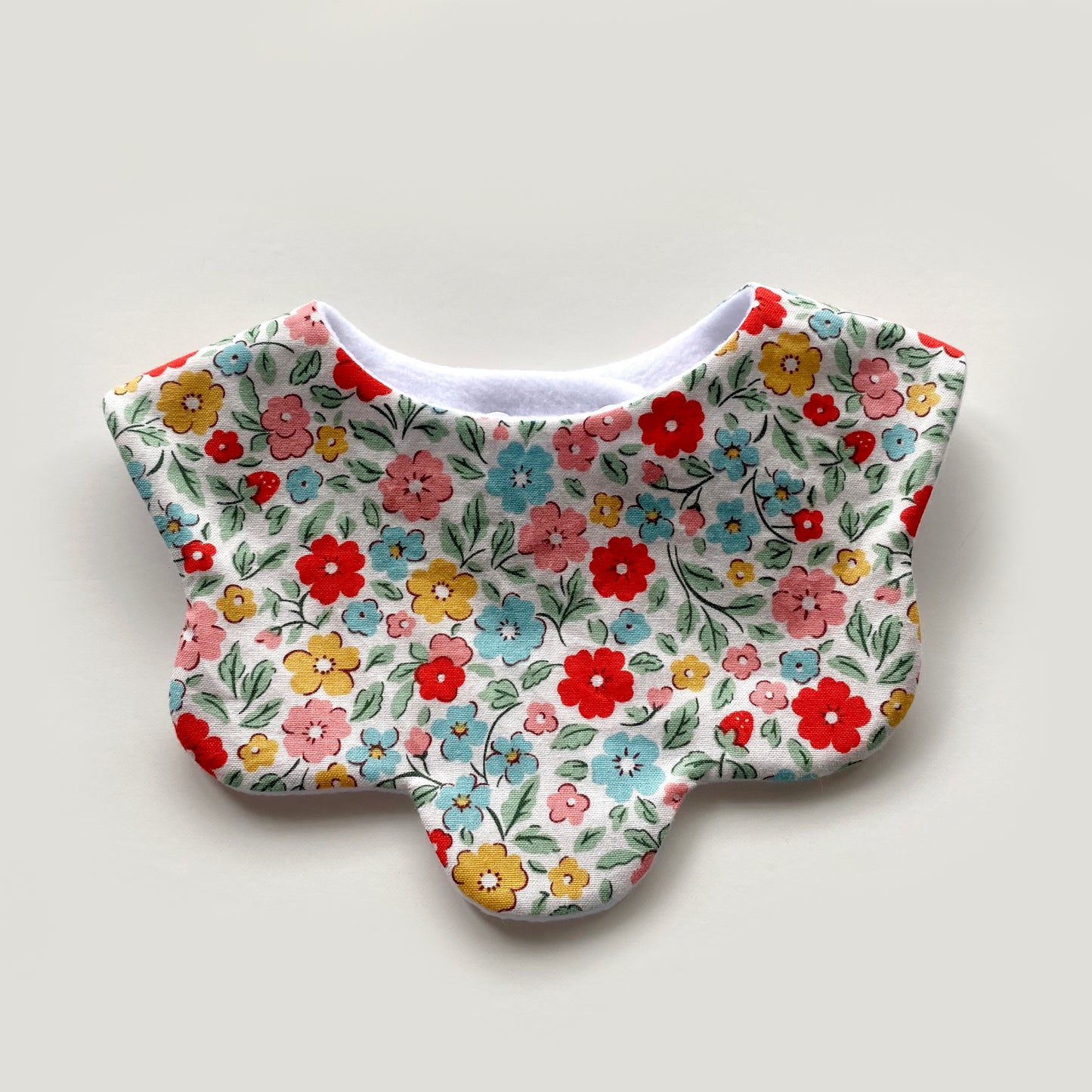 Rainbow floral scallop bib