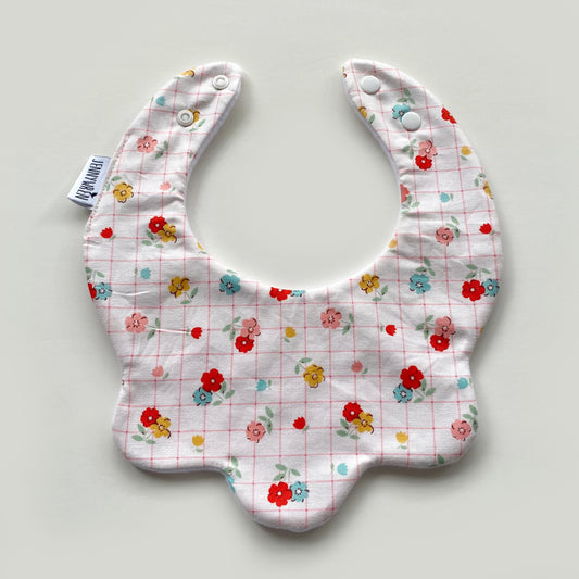 Floral with pink grid scallop bib
