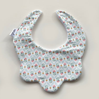 Turquoise and pink floral scallop bib