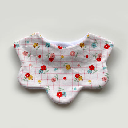 Floral with pink grid scallop bib