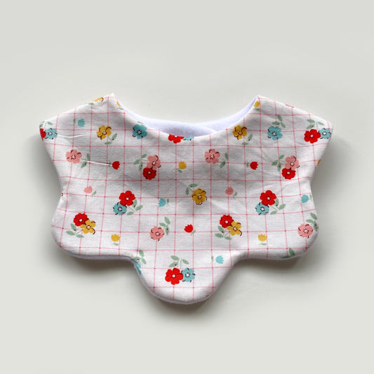 Floral with pink grid scallop bib