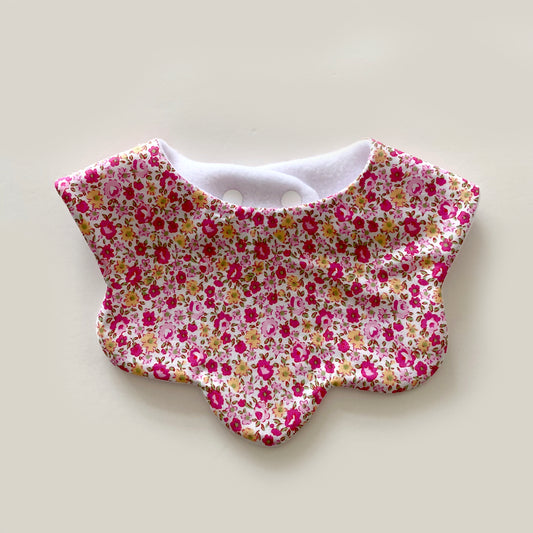 Fuchsia pink with yellow ditsy floral scallop bib