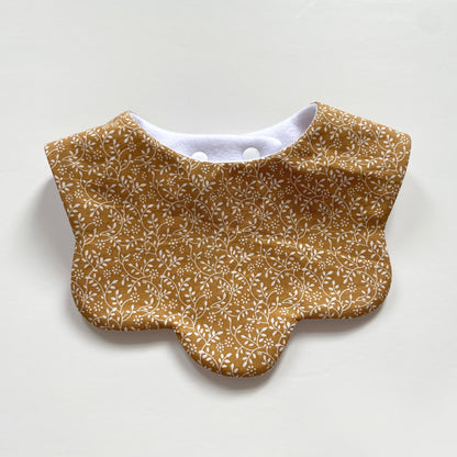 Mustard ditsy scallop bib