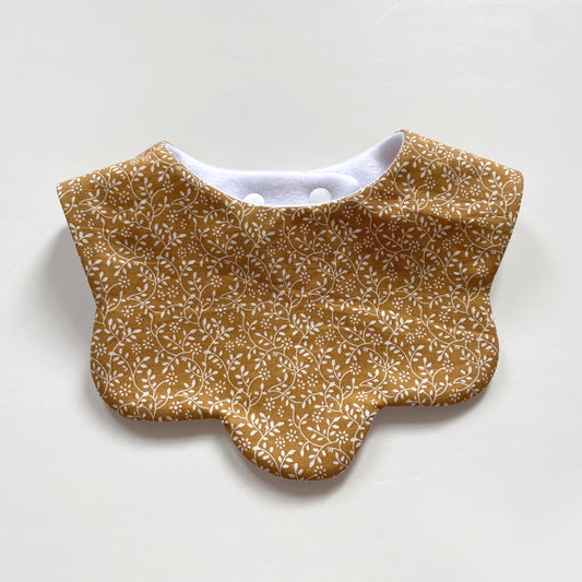 Mustard ditsy scallop bib
