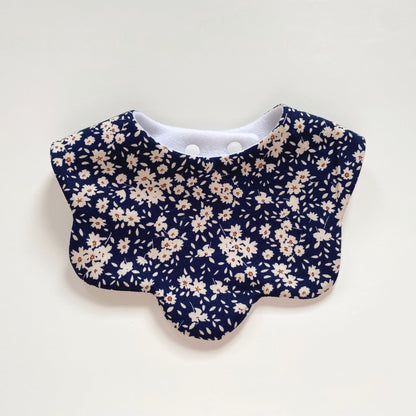 Navy blue floral scallop bib