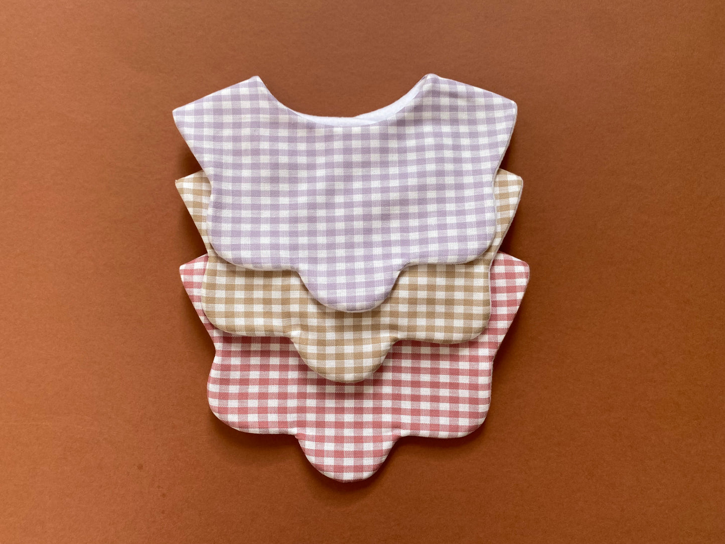 Choice of gingham scallop bib