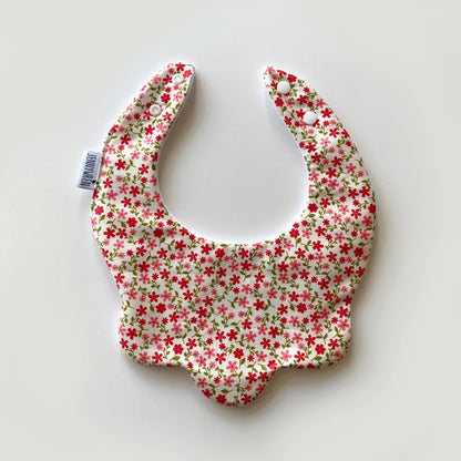 Red coral ditsy on cream scallop bib