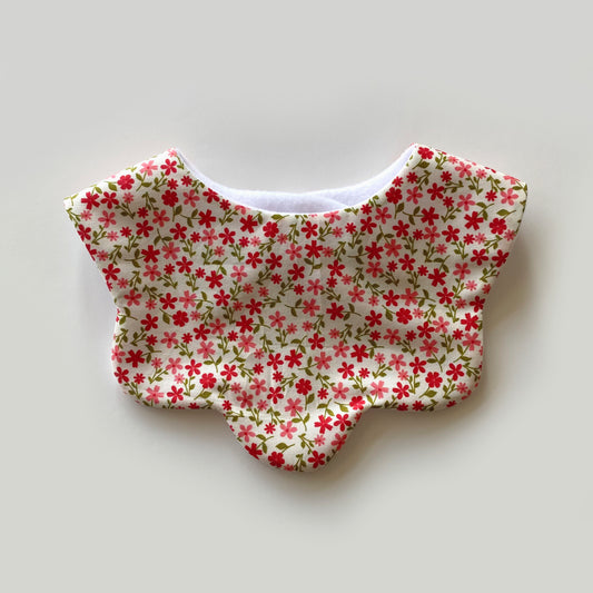 Red coral ditsy on cream scallop bib