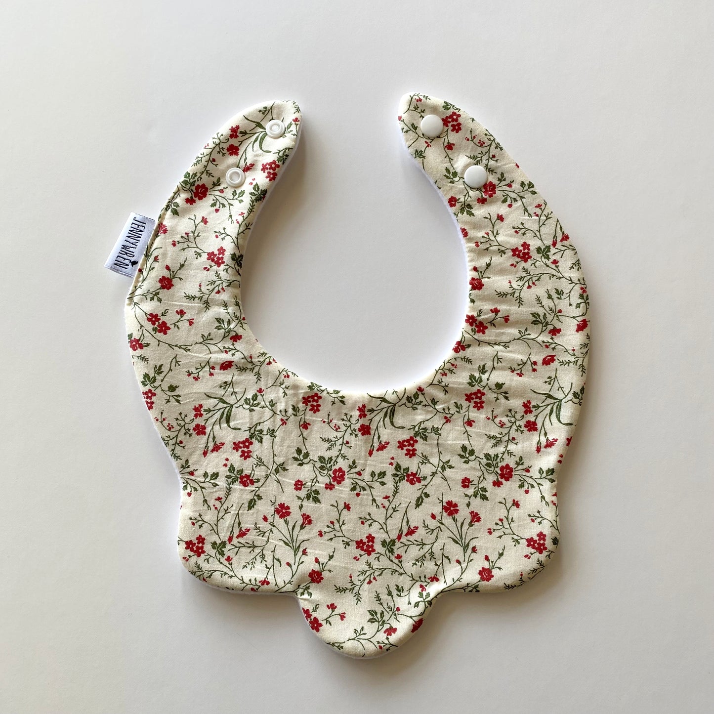 Cream vine floral scallop bib