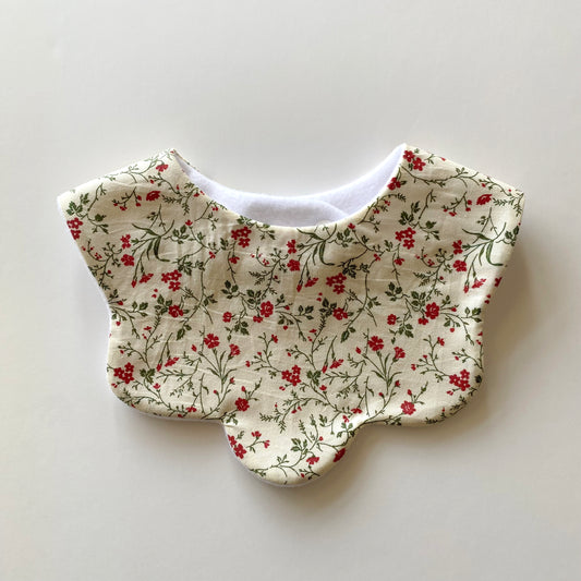 Cream vine floral scallop bib