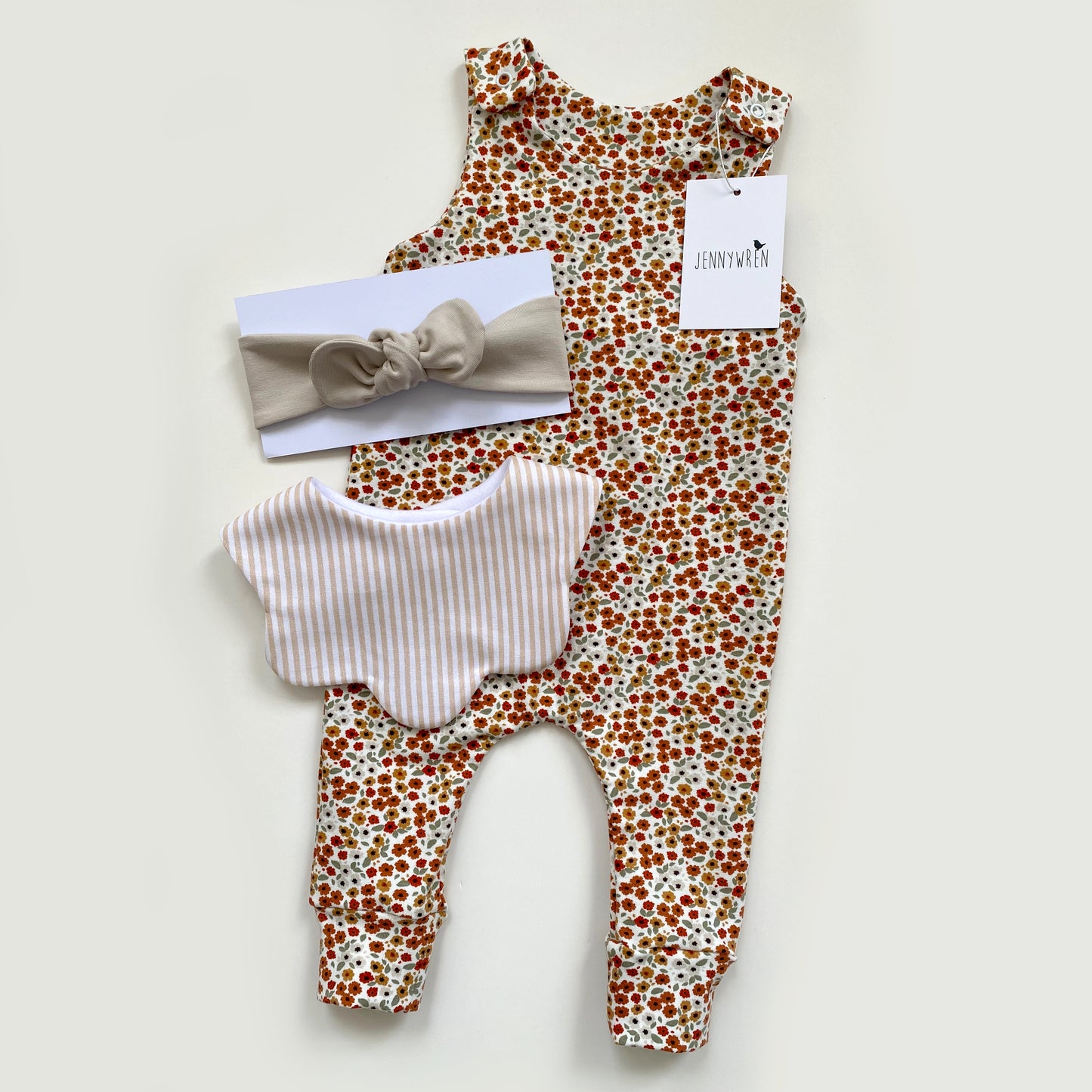 Ditsy floral romper, beige stripe bib and sand top knot headband set