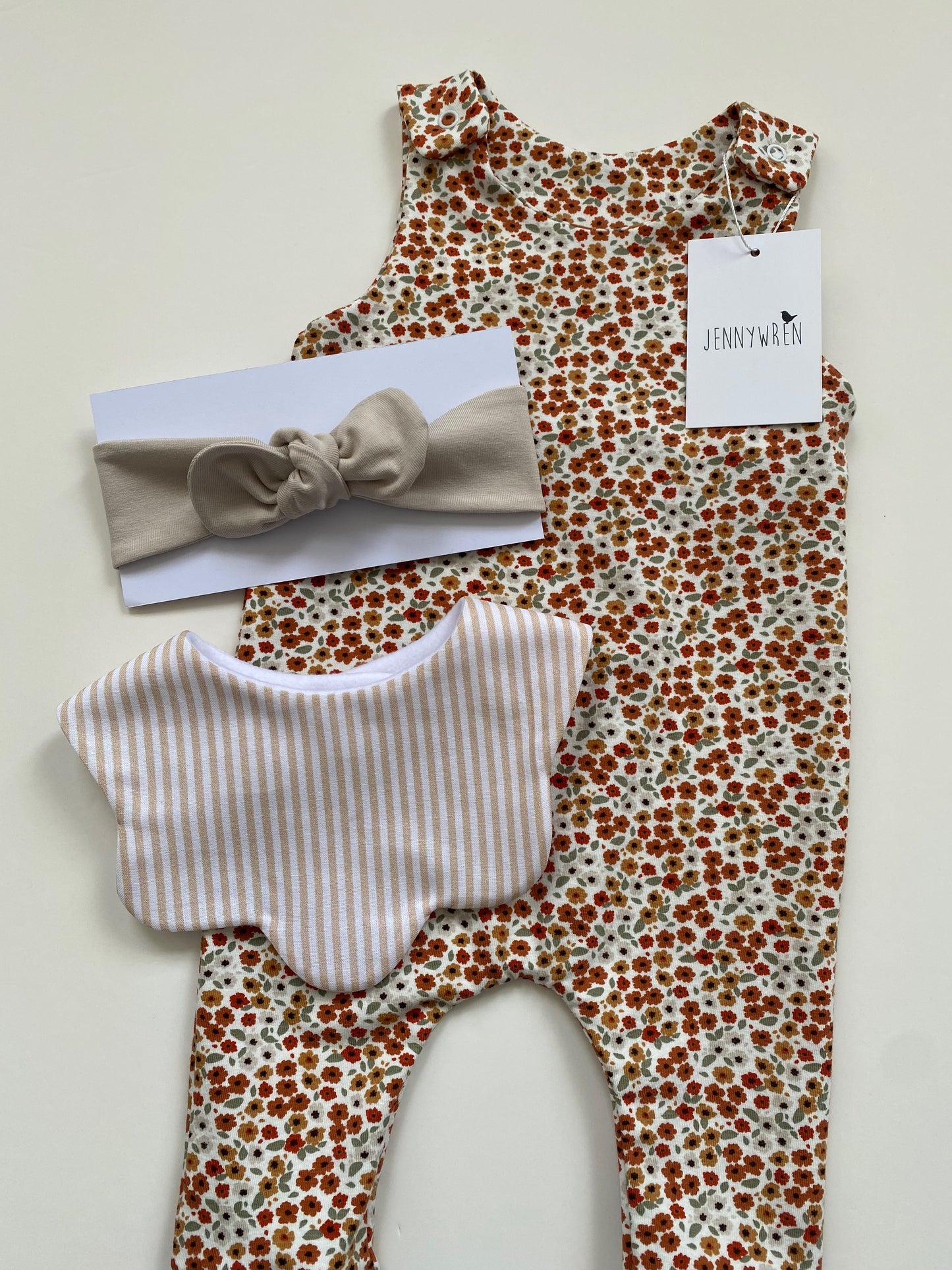 Ditsy floral romper, beige stripe bib and sand top knot headband set