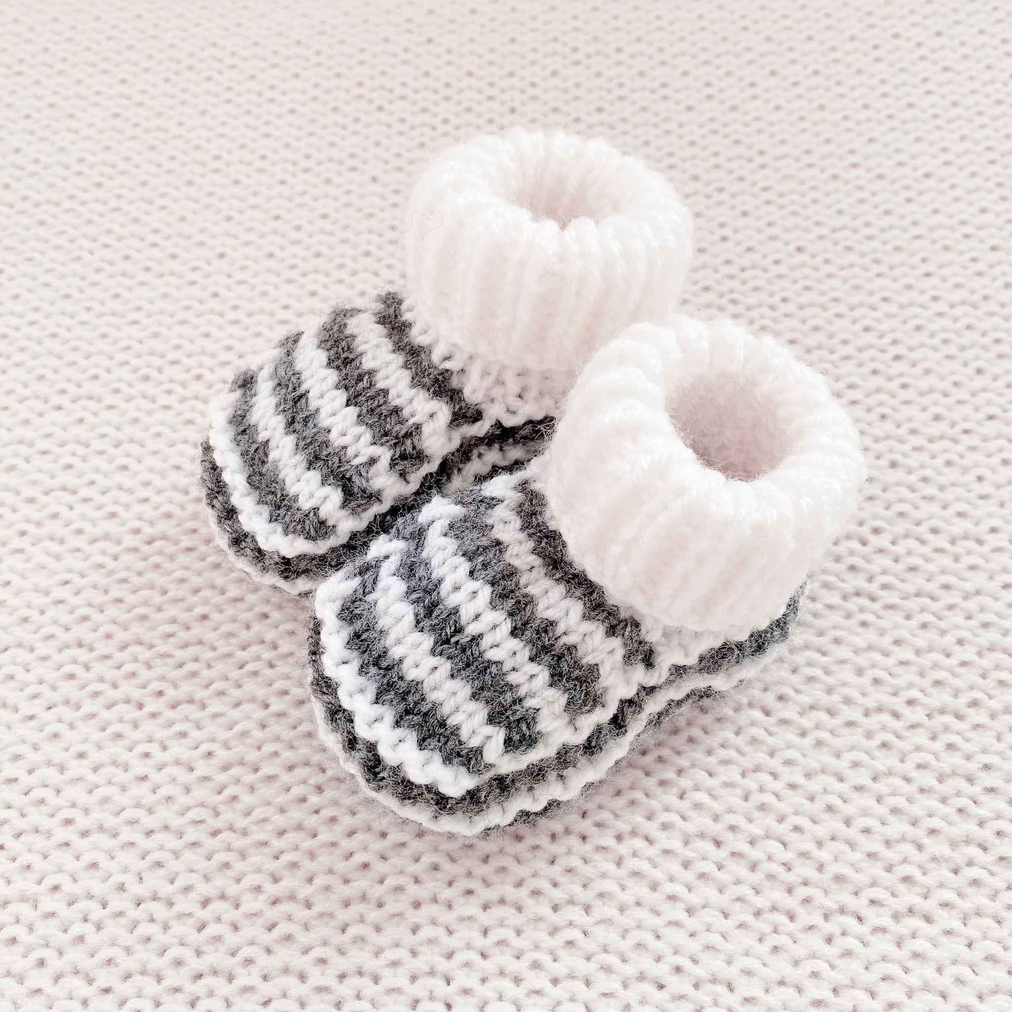 Knitted booties dark grey stripe