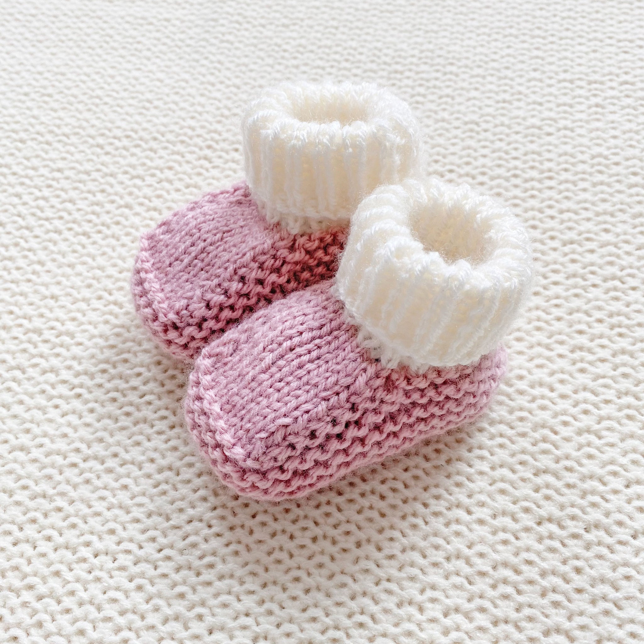 Knitted booties dusky pink
